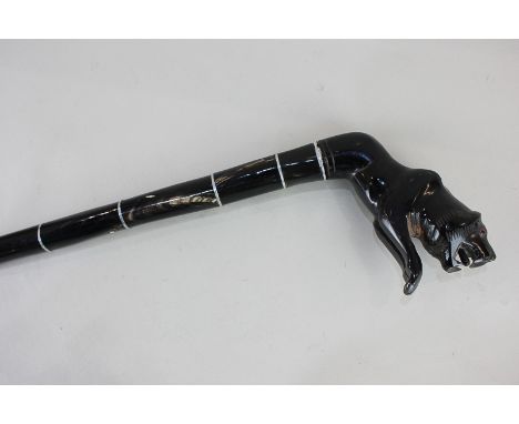 A hardwood walking stick, the handle modelled as a big cat