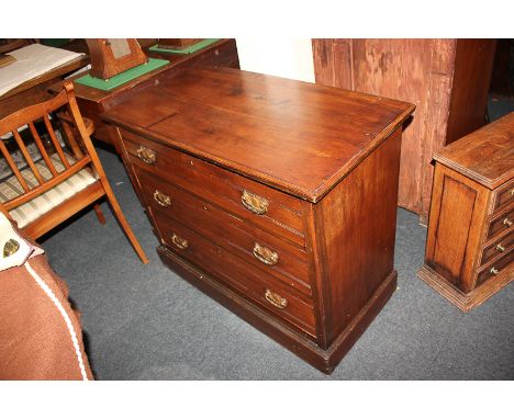 An Edwardian mahogany chest of three drawers with drop handles, on plinth base, 92cm