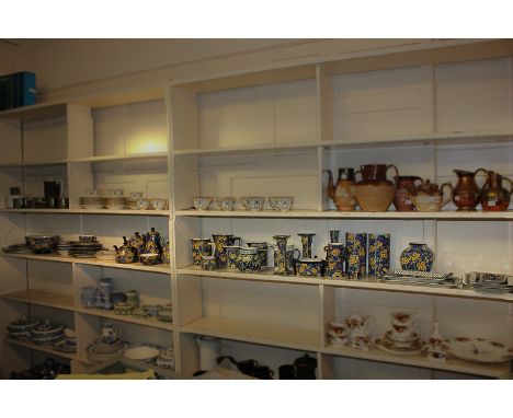 A large collection of Royal Doulton 'Prunus' tableware comprising seven assorted jugs, six vases, a pair of candlesticks, a t