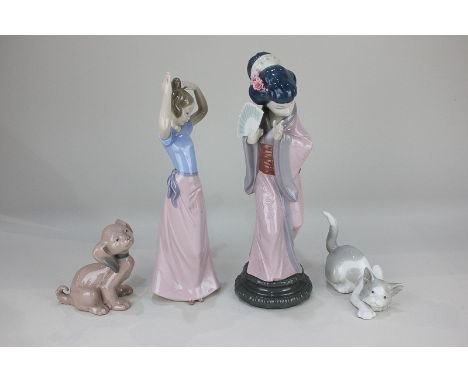 A Lladro porcelain figure of a geisha, boxed, a Lladro figure of a cat, and two Nao figures of a girl and a dog