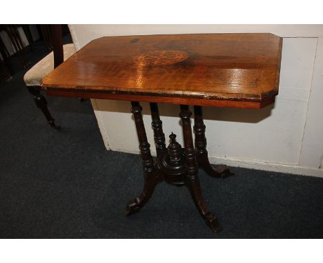 A Victorian inlaid walnut side table, rectangular cut corner top with central scroll panel, on four column pedestal base and 