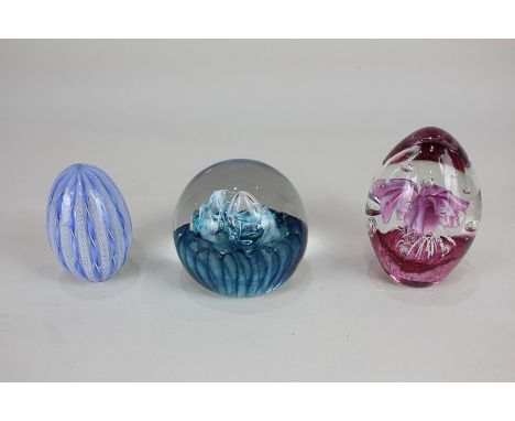 A Caithness paperweight, Quicksilver, a Murano glass paperweight, and another paperweight