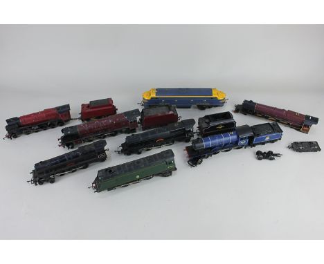 A collection of 00 gauge model railway locomotives, including a Tri-ang railways diesel, a Hornby British Railways steam engi