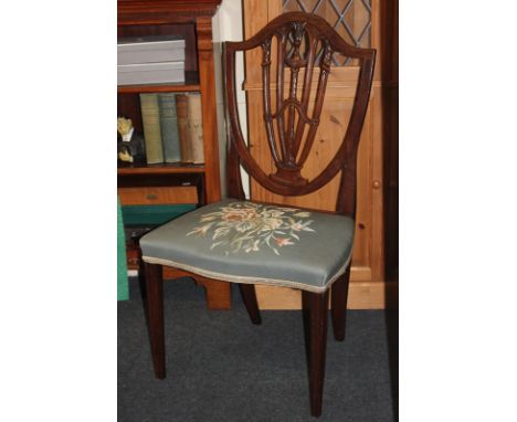 A Sheraton style shield back dining chair, with embroidered tapestry seat on square tapered legs