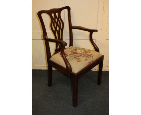 A Chippendale style mahogany carver dining chair with vase shaped pierced back splat and tapestry upholstered drop-in seat, o