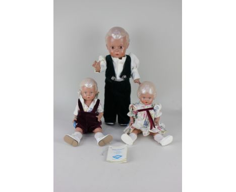 Three German Schildkrot (turtle) celluloid dolls comprising boy doll dressed in green velvet suit and white shoes, 34cm, with