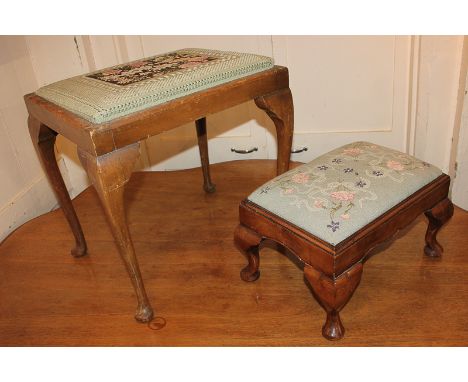 A rectangular walnut footstool with tapestry top, on cabriole feet, 41cm, and another larger footstool with slender cabriole 