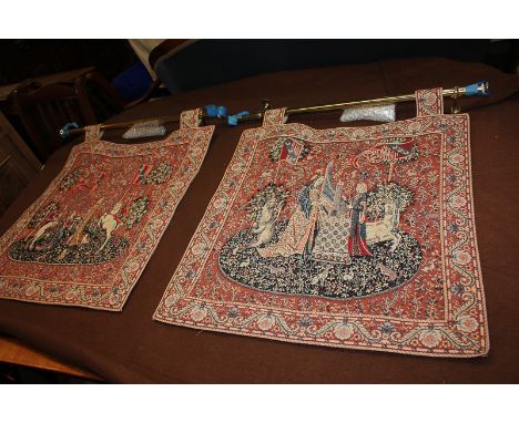 A pair of contemporary Flemish embroidered tapestry wall hangings of figures and heraldic beasts, on red floral ground, with 