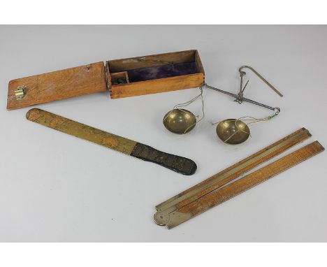 A John Rabone &amp; Sons folding ruler, in two sections with brass hinges, together with a cased set of apothecary scales and