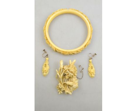 A Victorian floral-carved ivory brooch, to/w a floral carved ivory bangle and a pair of similar ear-drops (4)