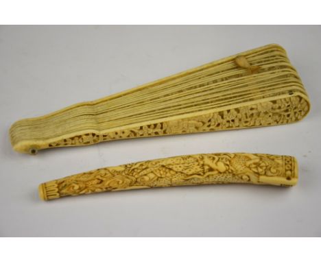 A Chinese 19th century Canton ivory brise fan, the boards carved with figures and pine trees, the nineteen sticks finely carv