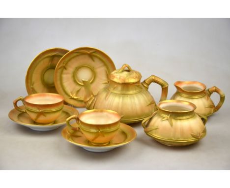 A Royal Worcester part tea service moulded with bamboo, gilded blush ground, date cypher 1902/3 comprising teapot, sugar bowl