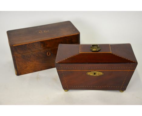 An early 19th century inlaid mahogany sarcophagus tea caddy with two lidded compartments and associated glass bowl, 18 cm wid