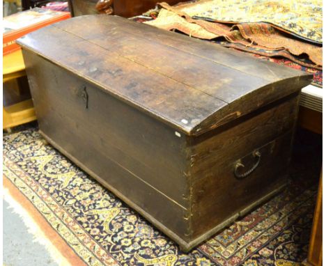 An antique oak dome top trunk having hand cut iron hinges and wrought iron carrying handles, by repute a seaman's trunk, 127 