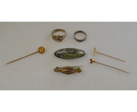 Three stick pins including one 15ct with gypsy set red stone, on wishbone and one flower to/w two bar brooches, silver buckle