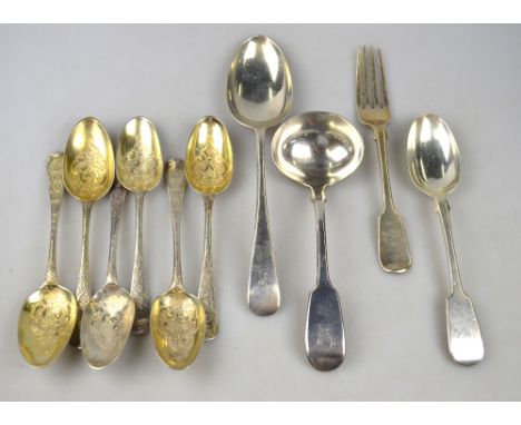 A set of six parcel gilt dessert spoons of Georgian origin, with later engraved decoration, to/w a William IV fiddle pattern 