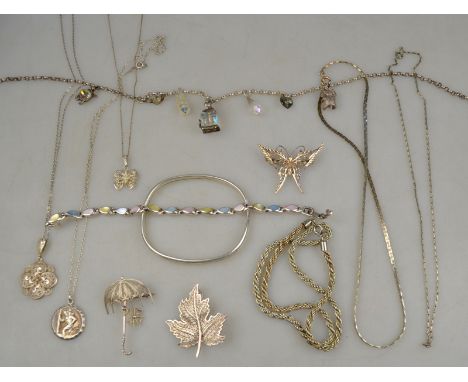 A collection of seven various necklaces and pendants, some silver to/w three brooches comprising umbrella, butterfly and mapl