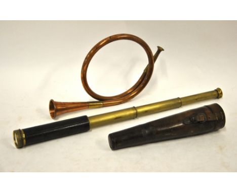 A brass three-drawer pocket telescope in associated leather case, to/w a curled copper hunting horn (2)