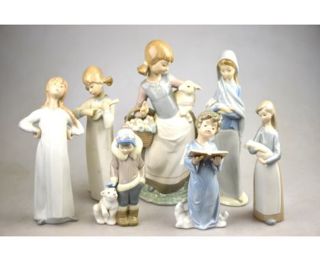 Seven Lladro figures - girl holding lamb and basket, 25 cm; Girl with violin 20.7 cm; singing angel 16.5 cm; Eskimo boy with 