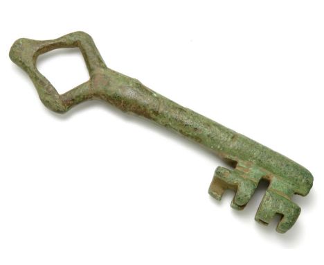 Large Medieval Key. Circa 13th/14th century AD. Copper-alloy, 96.74 mm. A heavy cast bronze door key with a hollow shaft, dou