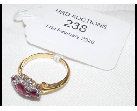 A ruby and diamond ring in 18ct gold setting CONDITION REPORTsize M approx