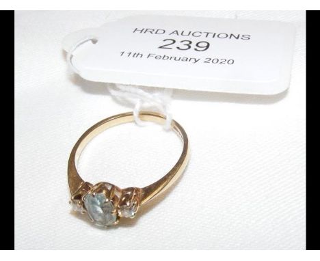 A lady's blue stone and diamond ring in 9ct gold setting 