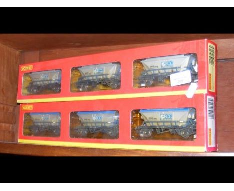 A boxed Hornby three hopper set, together with one other 