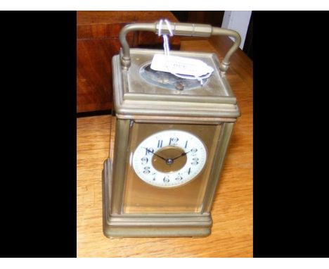 An antique repeater brass cased carriage clock - 16cm high CONDITION REPORTAs seen in additional images.Ticks okay.