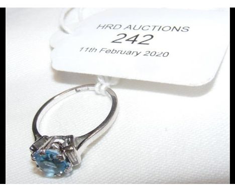 A lady's aquamarine and diamond ring in platinum setting 