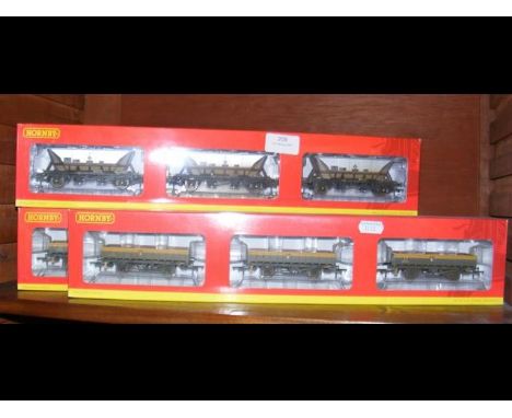 A boxed Hornby three hopper set, together with two others 
