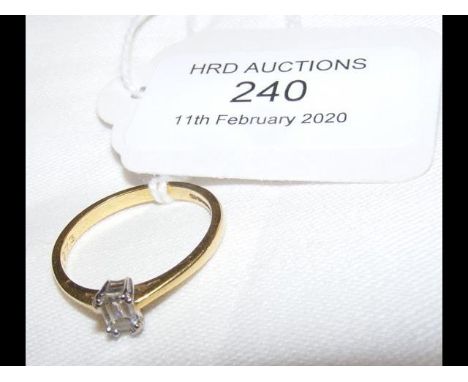 A diamond baguette shaped Solitaire ring in gold setting (0.26 carat)  