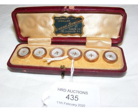 A cased set of six Mother-of-Pearl buttons 