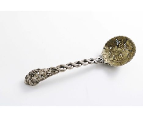 A VICTORIAN CAST SUGAR SIFTER LADLE in a pierced vine pattern with a gilt bowl and a vacant cartouche, by George Adams, Londo