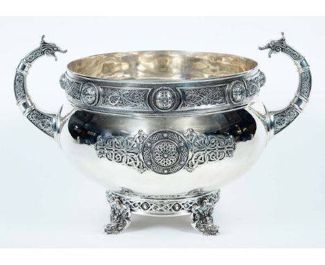 AN EDWARDIAN IRISH TWO-HANDLED CUP OR ROSE BOWL with applied "Celtic" strap-work, zoomorphic interlaced scrolls and large dom