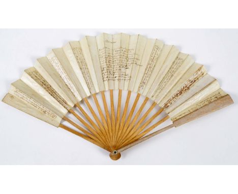 CHARADES A fan with plain wood guards and sticks, glazed paper leaves with manuscript verses on both sides to be read for the