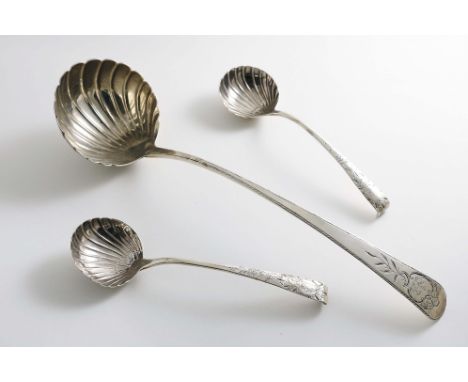 A GEORGE II IRISH SOUP LADLE with a fluted circular bowl and a Feather-edge stem with a chased cartouche, crested and engrave