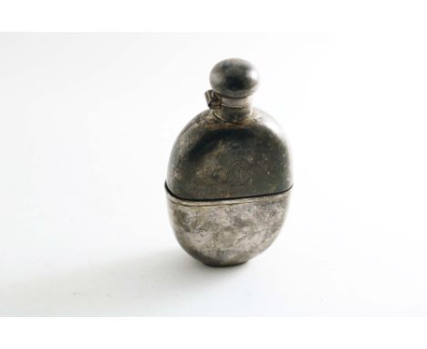 AN EARLY 20TH CENTURY OVAL SPIRIT FLASK with a pull-off drinking cup and a hinged, twist-open cover, monogrammed, by Martin H