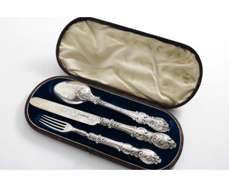 AN EARLY VICTORIAN CASED CHRISTENING KNIFE, FORK AND SPOON with decorative handles by Aaron Hadfield, Sheffield 1844/45 (the 