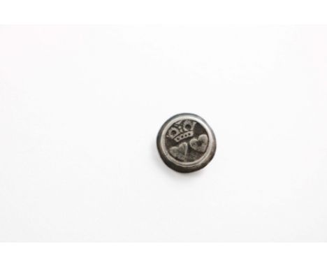 AN EARLY CHARLES II SMALL SLEEVE BUTTON stamped with two hearts below a crown, against a matt ground, with a bevelled edge, u
