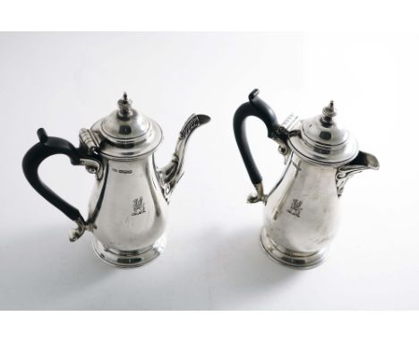 A PAIR OF EARLY 20TH CENTURY CAFE AU LAIT POTS with baluster bodies, spreading circular bases &amp; domed covers with knop fi