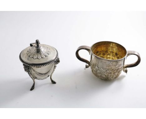 AN EDWARDIAN SMALL POT on three ram's mask and hoof feet with embossed festoons of foliage and a hinged, rising cover with a 