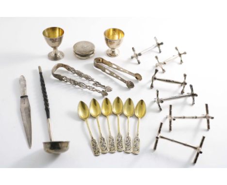A MIXED LOT:- Two egg cups, a matched pair of knife rests by John Wright of Newcastle 1842/57, two other pairs of knife rests