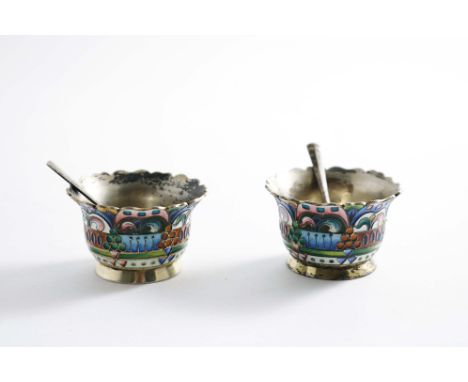 A PAIR OF EARLY 20TH CENTURY RUSSIAN SILVERGILT &amp; SHADED ENAMEL SALTS with shaped and everting rims, by the 26th Artel, M