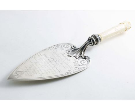 A LARGE, EARLY VICTORIAN PRESENTATION TROWEL with a carved ivory handle, chased &amp; engraved decoration and the inscription