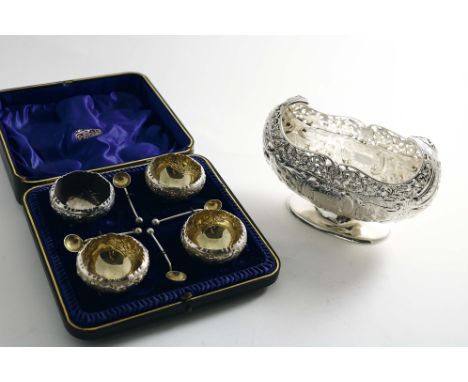 A LATE VICTORIAN BOAT-SHAPED BONBON DISH with pierced and embossed decoration and an oval foot, initialled, by G.M. Jackson, 