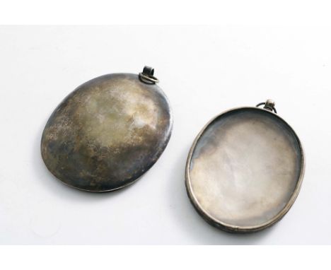 TWO LATE 17TH CENTURY OVAL PORTRAIT MINIATURE FRAMES with lift-out bezels and glass panels, dating from 1670-1700, unmarked; 