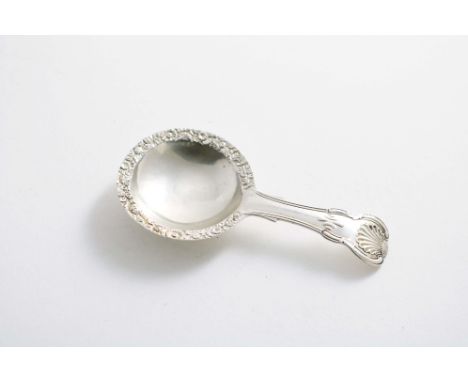 A LATE GEORGE III CADDY SPOON with an Hourglass pattern stem and a circular bowl with a chased border, by Joseph Wilmore, Bir