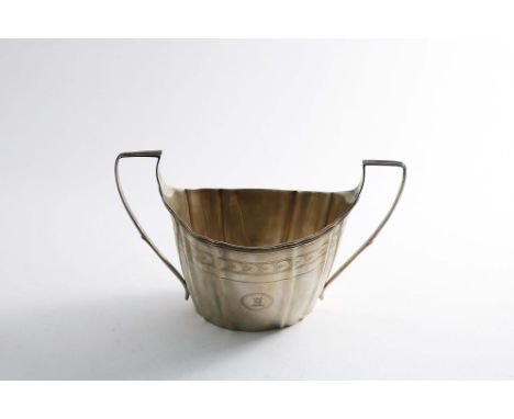 A GEORGE III IRISH PROVINCIAL TWO HANDLED SUGAR BASIN with an engraved frieze &amp; pricked borders, crested on one side, by 