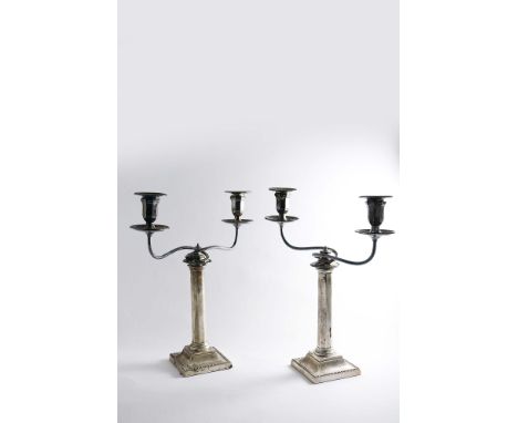 A PAIR OF LATE VICTORIAN CANDLESTICKS on bevelled square bases with octagonal columns and bead borders, by R. Martin &amp; E.