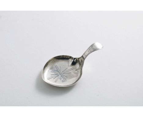 A GEORGE III CADDY SPOON with a shallow heart-shaped bowl, decorated with pricked engraving, no maker's mark, Birmingham 1799
